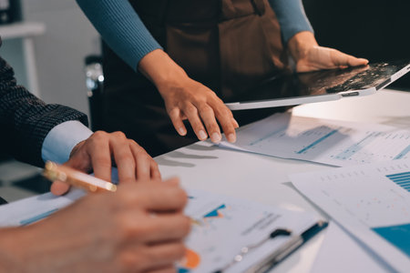 Accounting company provide finance and taxation planning for profitable cash flow, Auditor and accountant team working in office, analyze financial data and accounting record with calculator.Insightの写真素材