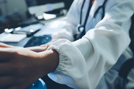 Male doctors shake hands with patients encouraging each other and praying for blessings. To offer...