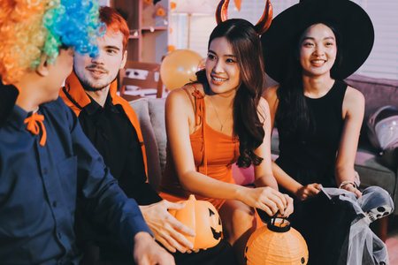 Joyful office Halloween party with coworkers in costumes, celebrating with drinks and laughter, fostering teamwork and festive spiritの写真素材