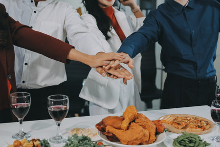 Diversity, dinner and group of people toast celebration together at party. Friends, happy and celebrate with food, wine and friendship for love, support and cheers champagne at business functionの写真素材