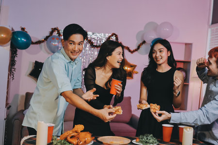 Diversity, dinner and group of people toast celebration together at party. Friends, happy and celebrate with food, wine and friendship for love, support and cheers champagne at business functionの写真素材