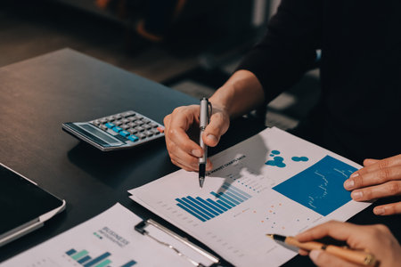 Accounting company provide finance and taxation planning for profitable cash flow, Auditor and accountant team working in office, analyze financial data and accounting record with calculator.Insightの写真素材