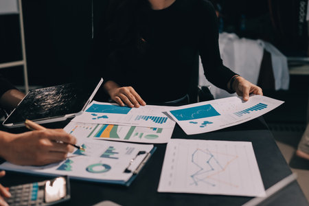 Accounting company provide finance and taxation planning for profitable cash flow, Auditor and accountant team working in office, analyze financial data and accounting record with calculator.Insightの写真素材