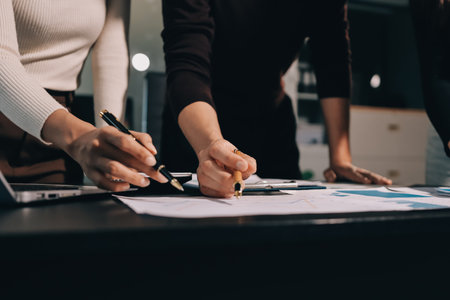 Accounting company provide finance and taxation planning for profitable cash flow, Auditor and accountant team working in office, analyze financial data and accounting record with calculator.Insightの写真素材