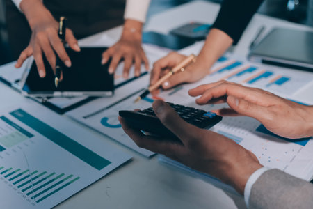 Accounting company provide finance and taxation planning for profitable cash flow, Auditor and accountant team working in office, analyze financial data and accounting record with calculator.Insightの写真素材