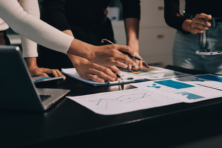 Accounting company provide finance and taxation planning for profitable cash flow, Auditor and accountant team working in office, analyze financial data and accounting record with calculator.Insightの写真素材