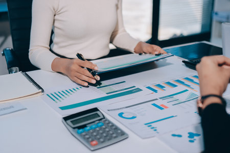 Accounting company provide finance and taxation planning for profitable cash flow, Auditor and accountant team working in office, analyze financial data and accounting record with calculator.Insightの写真素材