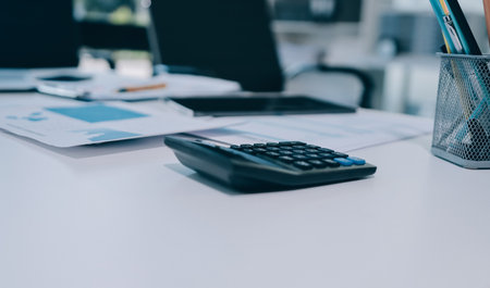 Accounting company provide finance and taxation planning for profitable cash flow, Auditor and accountant team working in office, analyze financial data and accounting record with calculator.Insightの写真素材