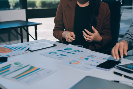 Accounting company provide finance and taxation planning for profitable cash flow, Auditor and accountant team working in office, analyze financial data and accounting record with calculator.Insightの写真素材