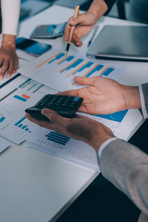 Accounting company provide finance and taxation planning for profitable cash flow, Auditor and accountant team working in office, analyze financial data and accounting record with calculator.Insightの写真素材