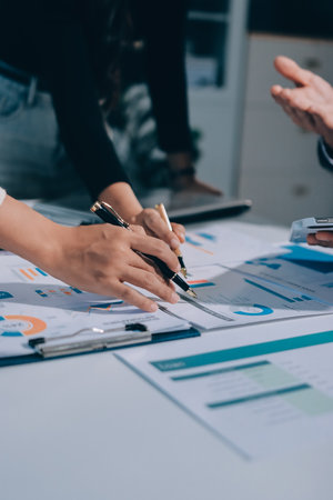 Accounting company provide finance and taxation planning for profitable cash flow, Auditor and accountant team working in office, analyze financial data and accounting record with calculator.Insightの写真素材