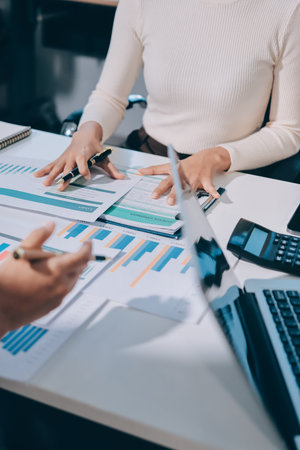 Accounting company provide finance and taxation planning for profitable cash flow, Auditor and accountant team working in office, analyze financial data and accounting record with calculator.Insightの写真素材