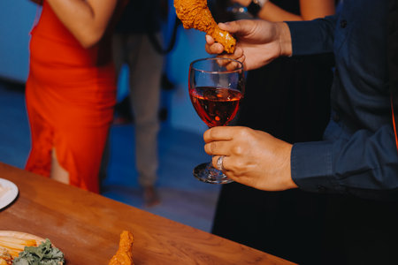 Joyful office Halloween party with coworkers in costumes, celebrating with drinks and laughter, fostering teamwork and festive spiritの写真素材