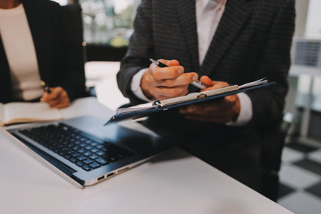 Accounting company provide finance and taxation planning for profitable cash flow, Auditor and accountant team working in office, analyze financial data and accounting record with calculator.Insightの写真素材