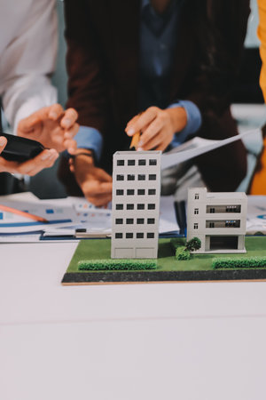 Real estate agent and customer signing contract to buy house, insurance or loan real estate.の写真素材