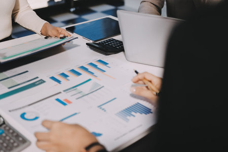 Accounting company provide finance and taxation planning for profitable cash flow, Auditor and accountant team working in office, analyze financial data and accounting record with calculator.Insightの写真素材