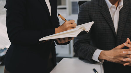 Accounting company provide finance and taxation planning for profitable cash flow, Auditor and accountant team working in office, analyze financial data and accounting record with calculator.Insightの写真素材