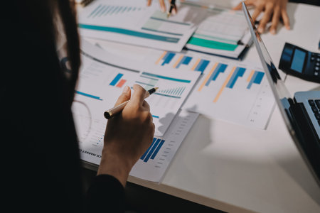 Accounting company provide finance and taxation planning for profitable cash flow, Auditor and accountant team working in office, analyze financial data and accounting record with calculator.Insightの写真素材