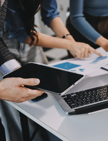 Accounting company provide finance and taxation planning for profitable cash flow, Auditor and accountant team working in office, analyze financial data and accounting record with calculator.Insightの写真素材