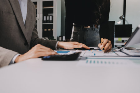 Accounting company provide finance and taxation planning for profitable cash flow, Auditor and accountant team working in office, analyze financial data and accounting record with calculator.Insightの写真素材