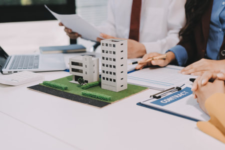 Real estate agent and customer signing contract to buy house, insurance or loan real estate.rent a house,get insurance or loan real estate or property.の写真素材