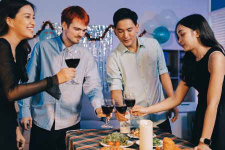 Diversity, dinner and group of people toast celebration together at party. Friends, happy and celebrate with food, wine and friendship for love, support and cheers champagne at business functionの写真素材