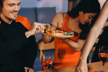 Joyful office Halloween party with coworkers in costumes, celebrating with drinks and laughter, fostering teamwork and festive spiritの写真素材