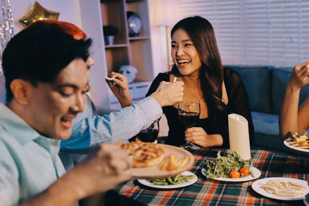 Diversity, dinner and group of people toast celebration together at party. Friends, happy and celebrate with food, wine and friendship for love, support and cheers champagne at business functionの写真素材