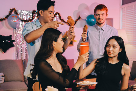 Diversity, dinner and group of people toast celebration together at party. Friends, happy and celebrate with food, wine and friendship for love, support and cheers at business functionの写真素材