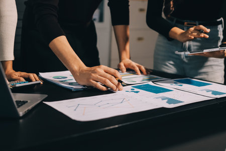 Accounting company provide finance and taxation planning for profitable cash flow, Auditor and accountant team working in office, analyze financial data and accounting record with calculator.Insightの写真素材