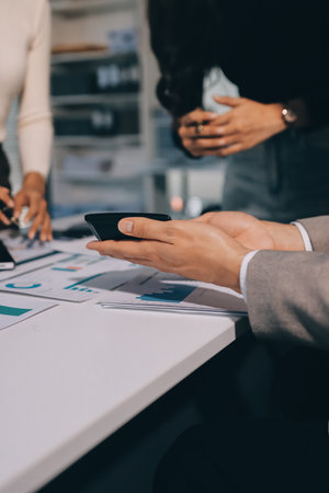 Accounting team working in office, analyze financial data and accounting record with calculator.の写真素材