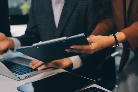 Accounting company provide finance and taxation planning for profitable cash flow, Auditor and accountant team working in office, analyze financial data and accounting record with calculator.Insightの写真素材