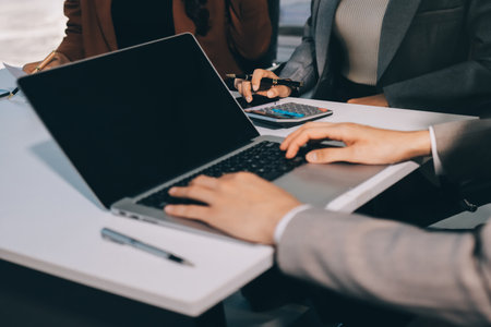 Accounting company provide finance and taxation planning for profitable cash flow, Auditor and accountant team working in office, analyze financial data and accounting record with calculator.Insightの写真素材