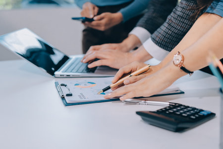 Accounting company provide finance and taxation planning for profitable cash flow, Auditor and accountant team working in office, analyze financial data and accounting record with calculator.Insightの写真素材