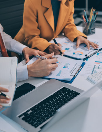 Accounting company provide finance and taxation planning for profitable cash flow, Auditor and accountant team working in office, analyze financial data and accounting record with calculator.Insightの写真素材