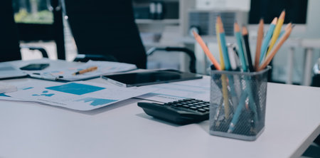 Accounting company provide finance and taxation planning for profitable cash flow, Auditor and accountant team working in office, analyze financial data and accounting record with calculator.Insightの写真素材