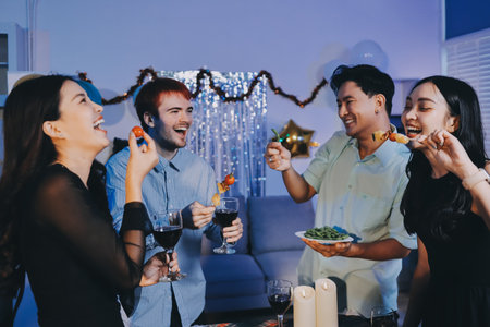 Diversity, dinner and group of people toast celebration together at party. Friends, happy and celebrate with food, wine and friendship for love, support and cheers champagne at business functionの写真素材