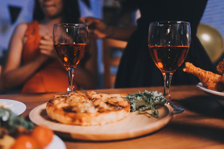 Joyful Halloween party with coworkers in costumes, celebrating with drinks and laughter, fostering teamwork and festive spiritの写真素材