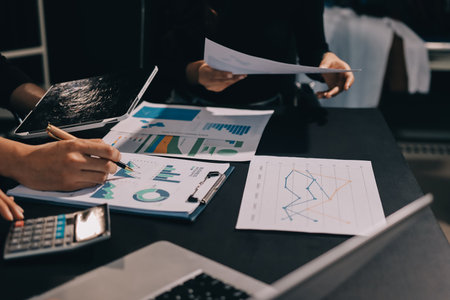 Accounting company provide finance and taxation planning for profitable cash flow, Auditor and accountant team working in office, analyze financial data and accounting record with calculator.Insightの写真素材