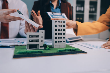 Real estate agent and customer signing contract to buy house, insurance or loan real estate.rent a...