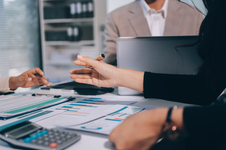 Accounting company provide finance and taxation planning for profitable cash flow, Auditor and accountant team working in office, analyze financial data and accounting record with calculator.Insightの写真素材