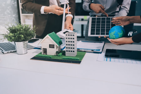 Group of businesspeople in team brainstorm meeting discussion on ESG (Environmental, social, corporate governance) organization planning. Sustainable business, coworker people teamwork. Close upの写真素材