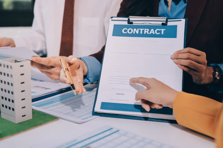 Real estate agent and customer signing contract to buy house, insurance or loan real estate.rent a...