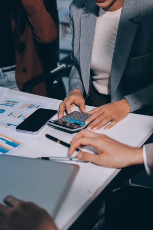 Accounting company provide finance and taxation planning for profitable cash flow, Auditor and accountant team working in office, analyze financial data and accounting record with calculator.Insightの写真素材