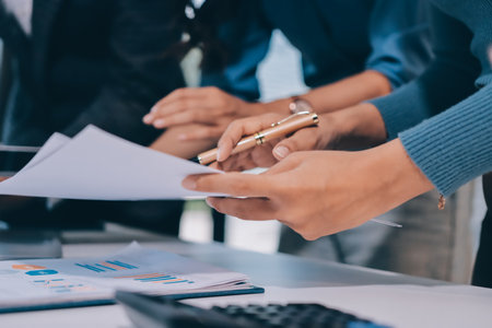 Accounting company provide finance and taxation planning for profitable cash flow, Auditor and accountant team working in office, analyze financial data and accounting record with calculator.Insightの写真素材