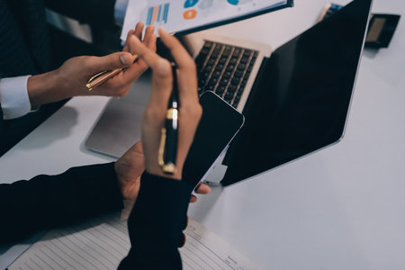 Accounting company provide finance and taxation planning for profitable cash flow, Auditor and accountant team working in office, analyze financial data and accounting record with calculator.Insightの写真素材