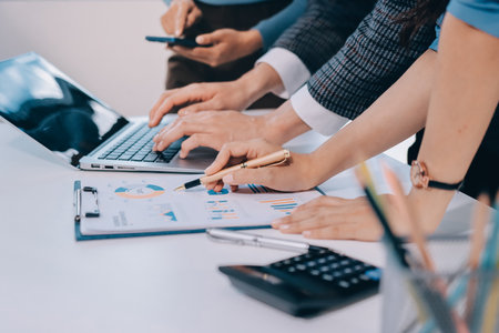 Accounting company provide finance and taxation planning for profitable cash flow, Auditor and accountant team working in office, analyze financial data and accounting record with calculator.Insightの写真素材