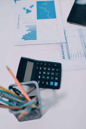 Accounting company provide finance and taxation planning for profitable cash flow, Auditor and accountant team working in office, analyze financial data and accounting record with calculator.Insightの写真素材