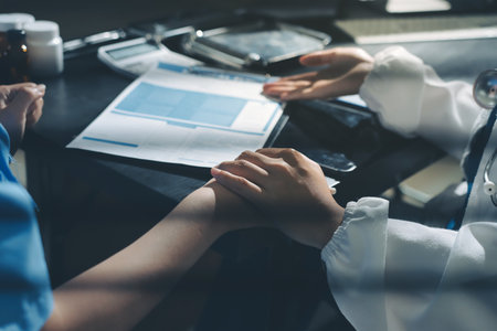 Male doctors shake hands with patients encouraging each other and praying for blessings. To offer love, concern, and encouragement while checking the patient's health. concept of medicineの写真素材