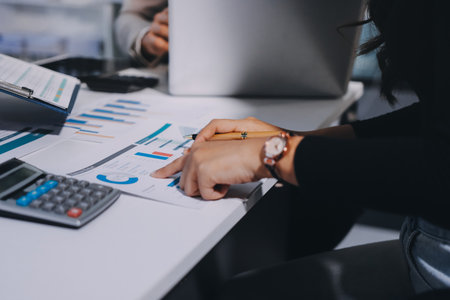 Accounting company provide finance and taxation planning for profitable cash flow, Auditor and accountant team working in office, analyze financial data and accounting record with calculator.Insightの写真素材